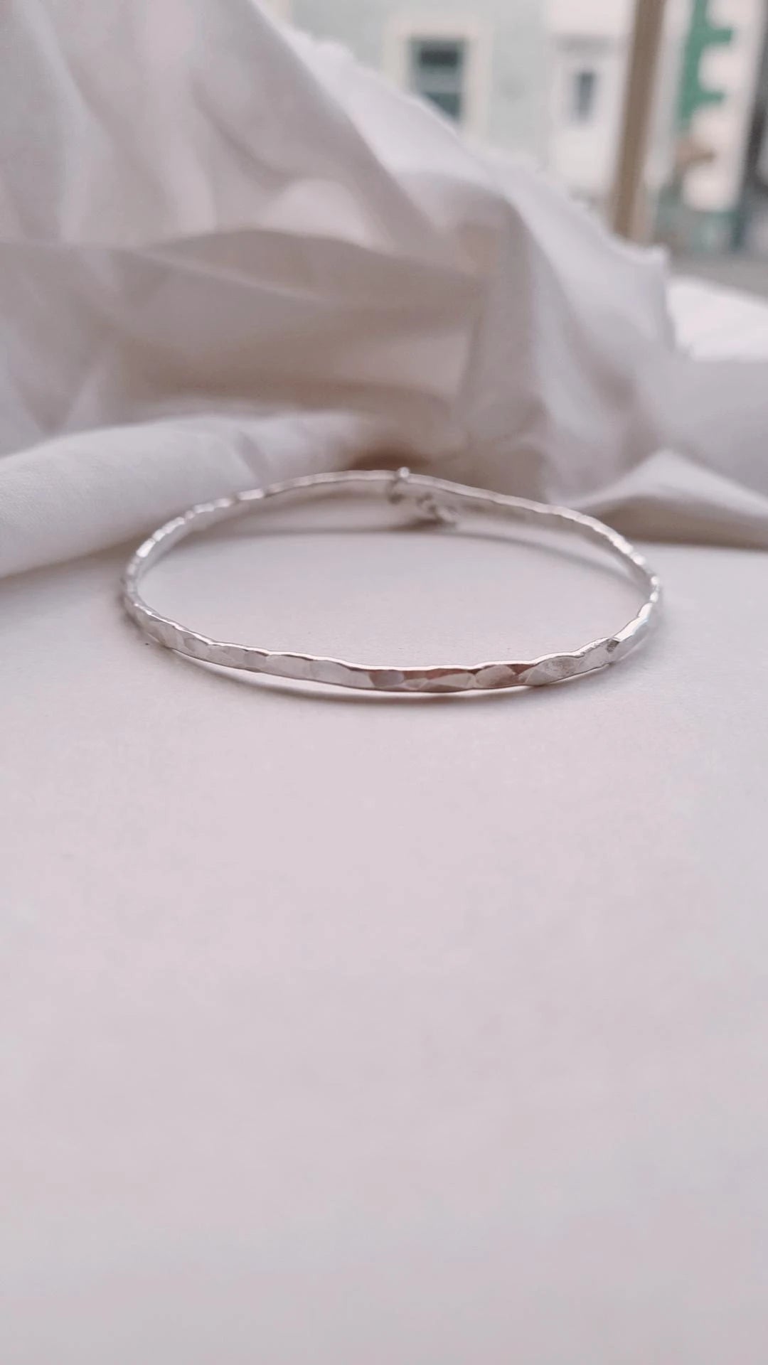 Textured silver bangle with personalised star charm.